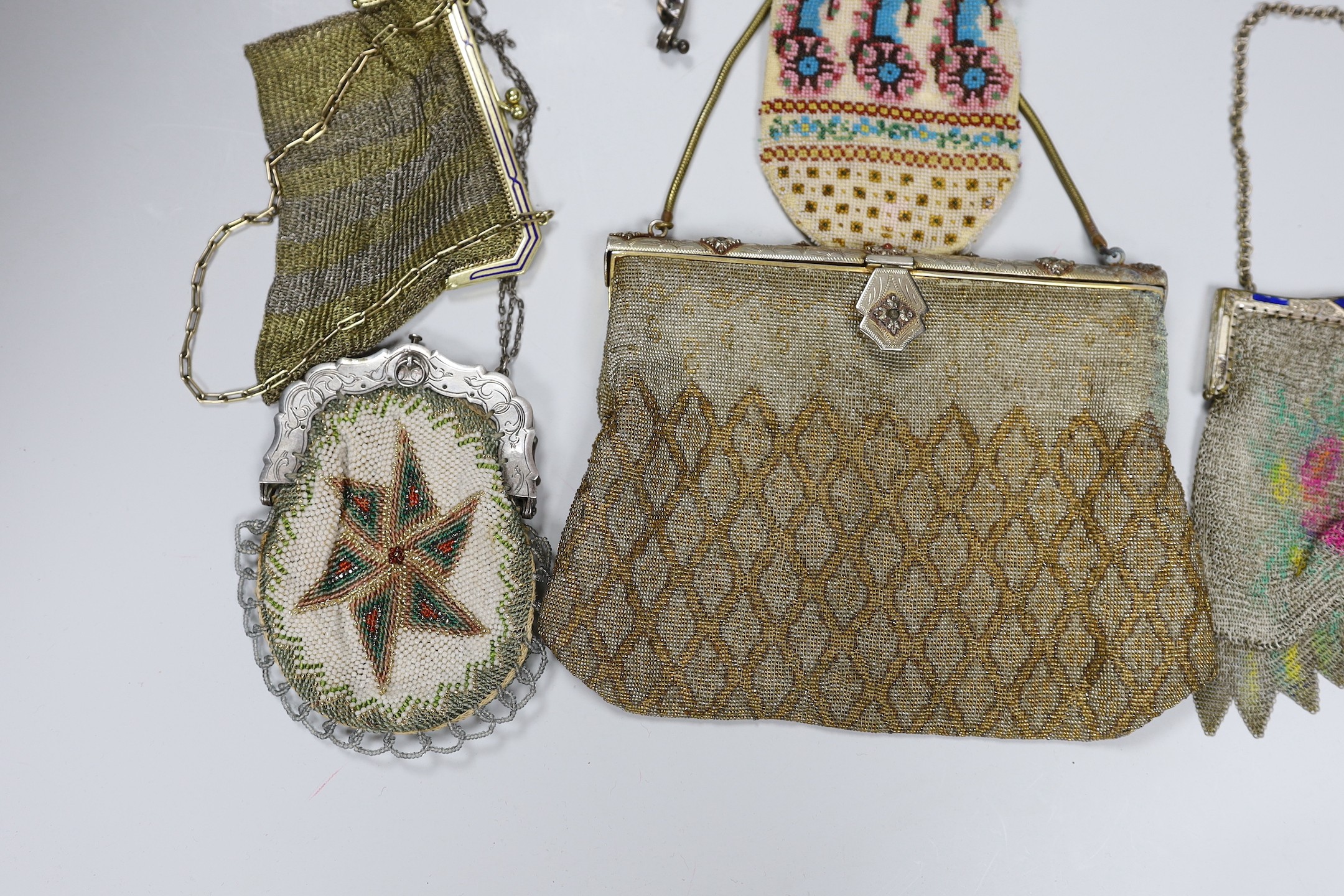 Two chain mail Edwardian handbags with enamelled frames, two 19th century beaded purses and a bag with ornate metal frames and two 20th century large metal bag frames (6)